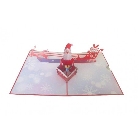 Biglietto pop-up di Natale con Babbo Natale nel camino e slitta con renne