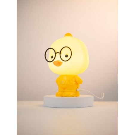 Lampada NelQuieOra Paperella vista laterale su base bianca, accesa con luce LED soffusa in ambiente neutro