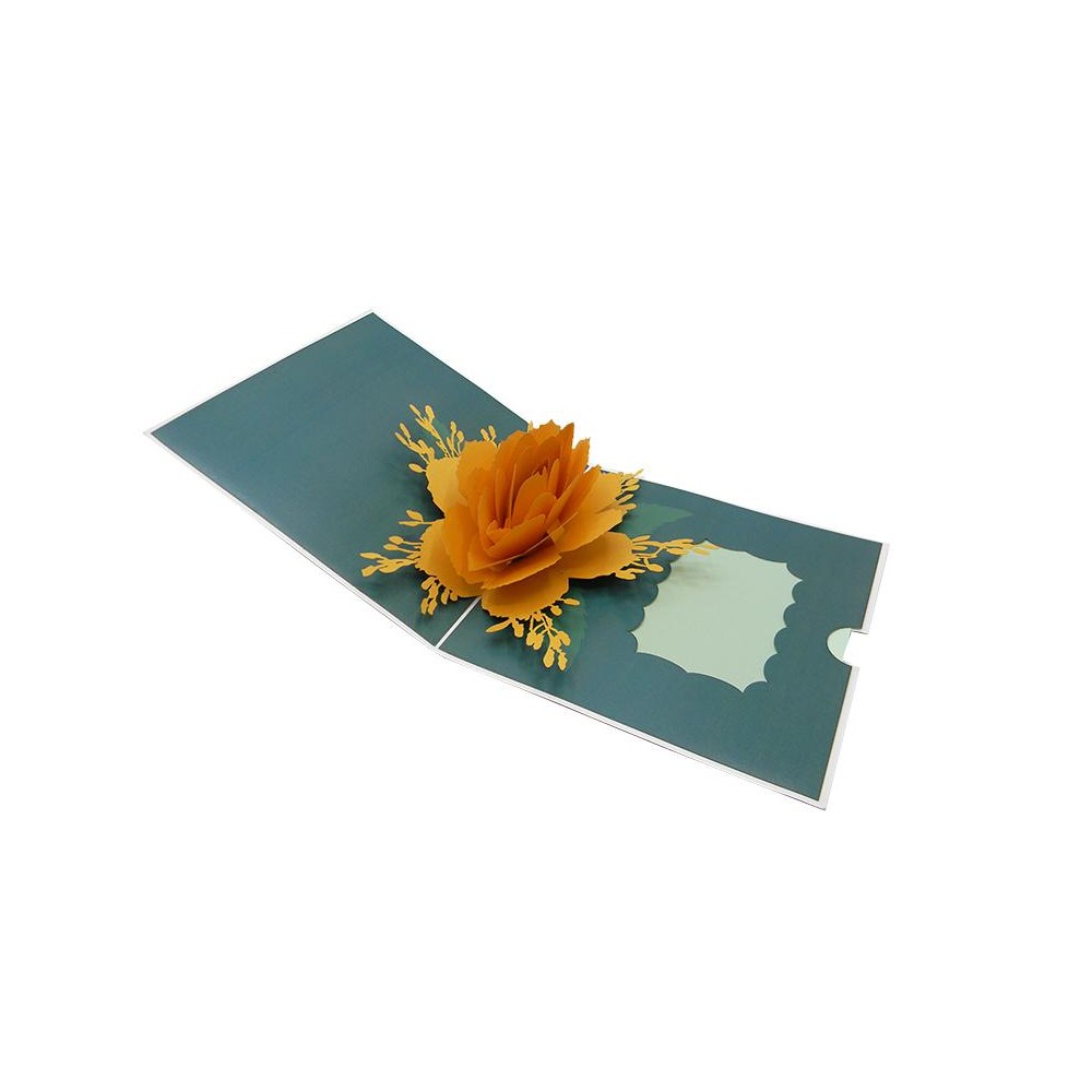 Biglietto auguri pop-up rosa dorata tridimensionale su sfondo verde