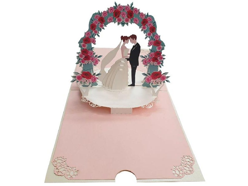 Biglietto pop-up 3D con arco di rose rosa e rosse e sposi abbracciati